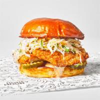 Crispy Fish Sandwich · Crispy cornmeal breaded flounder, cilantro-lime slaw, pickles, and remoulade on a toasted bun