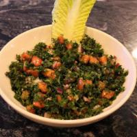 Tabouli · A Middle Eastern salad consisting of chopped parsley, wheat and finely cut tomatoes and onio...