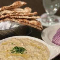 Baba Ghannouj · A combination of blended smoked eggplant, tahini (sesame seed paste), lemon and garlic, serv...