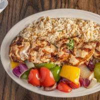Chicken Kabob · Boneless tender chicken skewered and broiled, served on a bed of rice pilaf and mixed vegeta...