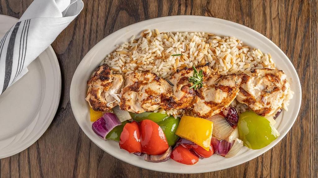Chicken Kabob · Boneless tender chicken skewered and broiled, served on a bed of rice pilaf and mixed vegetables.