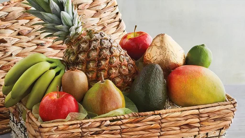 Tropical Fruit Basket · A beautiful arrangement of fresh tropical fruit delivered in a unique basket with a bow of your color choice!
Note: Fruit selection is based on availability and design time is approx 2+ hour(s). Please note any fruit that *should not* be included in the 