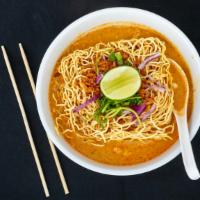 Khao Soi Lunch · Gluten-Free, spicy. Steamed egg noodle in a delicious mix of light yellow curry, topped with...
