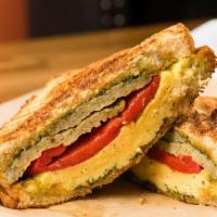 Egg Turkey Sausage · With basil pesto, roasted red peppers and three pepper colby jack on country white bread.
