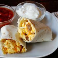 Breakfast Wrap · Egg, choice of protein with cheese and potatoes.  Accompanied with salsa and grits
