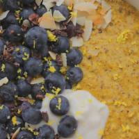 Turmeric Oatmeal · Turmeric, almond milk, berries and dried cranberries.