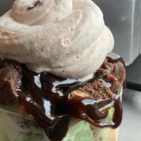 Thick Mint · Mint chip and chocolate ice cream topped with brownie bites, fudge and nutella whipped cream