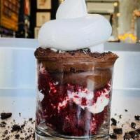 *New* Reign Of Terror · German chocolate cake ice cream with a frosted red velvet core, topped with a layer of choco...