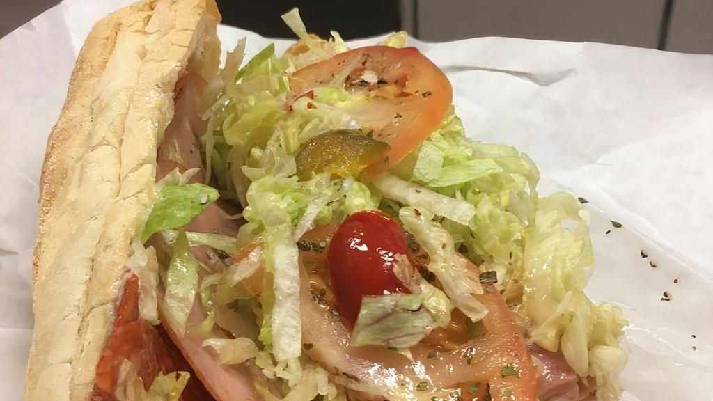 The Deli Chicken Cheese Steak · Provolone cheese, peppers, onions, lettuce, tomatoes and mayonnaise