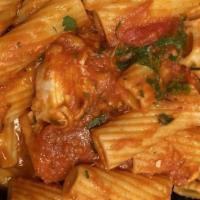 Arrabiatta · Chicken or shrimp in a spicy tomato sauce with roasted garlic and Italian parsley over ziti.