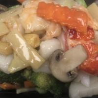 Seafood Delight · A combination of lobster meat, scallops, jumbo shrimp, and crab meat with Chinese vegetables.