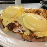 Classic · Two poached eggs and Canadian bacon on an English muffin, topped with hollandaise
