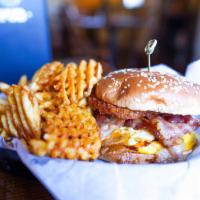 The Zo Burger · Half pound Angus burger, sharp Vermont cheddar, sautéed shrooms, caramelized onions, and bac...
