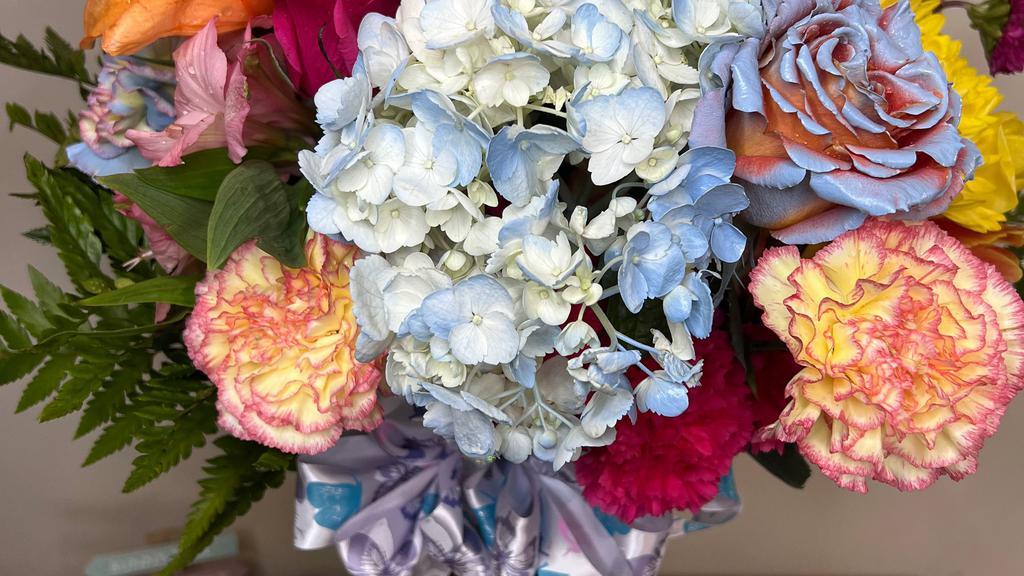 Kustom Sprayed Arrangement  · Designer choice of fresh flowers, sprayed and designed by customer favorite color choice.