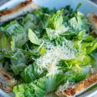 Caesar Salad · Chopped romaine lettuce, black peppers, french bread croutons and parmesean cheese served wi...