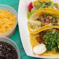Tres Tacos · Your choice of three tacos with a side of rice, beans and lettuce.