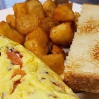 Cheese Omelet Your Way · A three egg omelet made with your choice of fillings with side of HomeTots.