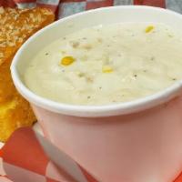 Chowder · Creamy chowder with clams, butter, onions, celery, garlic, native corn from our own farm, po...