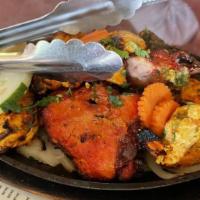 Malai Shrimp Kebab · Tiger shrimp marinated in Jayapuri style with hints of sautéed chickpea texture. Served with...