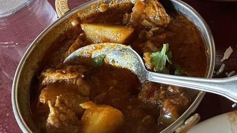 Lamb Vindaloo · Tender pieces of lamb cooked with potatoes, hot spices and fresh green herbs.