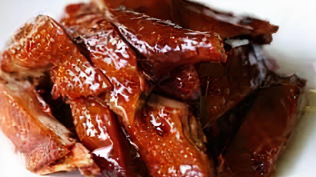 Shanghai Braised Duck酱鸭 · It is a special dish of shanghai it has a thick soy sauce color a bright oily texture and a sweet honey-like taste making it taste mellow and attractive.
