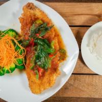 Crispy Catfish · Medium Spicy. Crispy deep fried catfish topped with spicy Thai herb sauce and side of steame...
