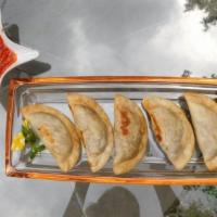 Argentinian Beef Empanada · Ground beef, green olives, red peppers, tomatoes, special spice.