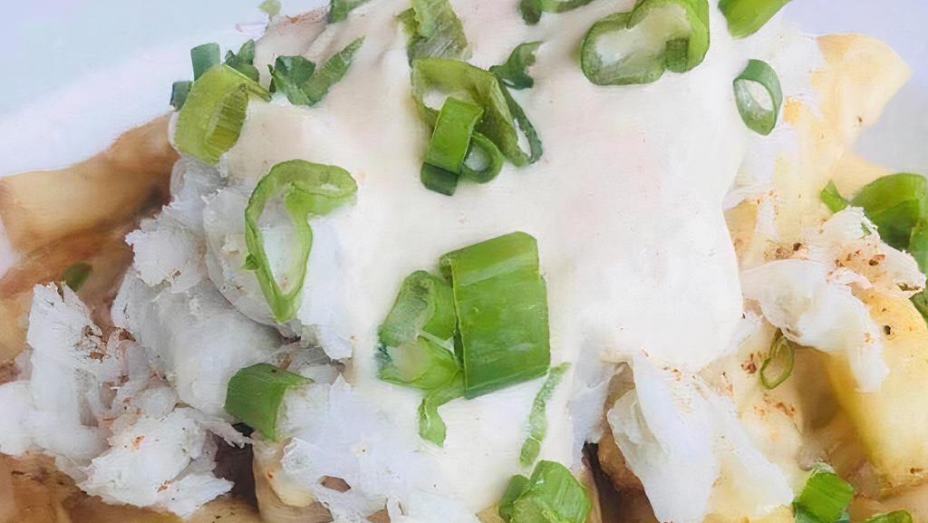 The Real Crab Fries · Crab meat, homemade cheese sauce, lemon aioli, spring onion.