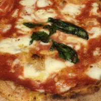 Margherita Pizza · Tomato sauce, mozzarella, parmigiano, basil.