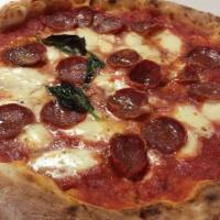 Calabria Pizza · Tomato sauce, mozzarella, spicy salami and basil.