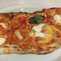 Calzone Pizza · Folded pizza stuffed with ricotta, mozzarella, salami, tomato sauce, ham.