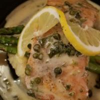Salmone · Salmon fillet, cooked in a lemon and caper sauce, served with asparagus and mashed potatoes.