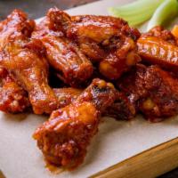 Bbq Wings · Deliciously crispy party wings with savory BBQ sauce. Comes with celery and bleu cheese.