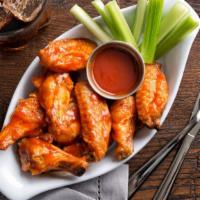 Buffalo Wings · Perfect party wings with delectable buffalo sauce. Comes with celery and bleu cheese.