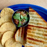 Savory Egg Panini (V) · Havarti, cheddar and egg with tomato grilled with a tangy garlic-parsley spread.