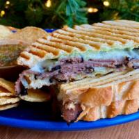 Pastrami Panini · Pastrami with a bite! A flavorful standard with Swiss cheese & tomato, Cuban slaw. Spread: d...