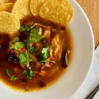 Spicy Chicken Tortilla Soup (Gf) · It's got snap! Chicken and house-roasted pasilla peppers, topped with tortilla chips and sal...