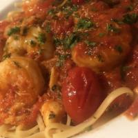 Shrimp Fra' Diavolo · Sautéed with Cherry Tomatoes, Crab Meat & Wine in a Spicy Marinara Sauce.