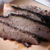 1/2 Lbs Sliced Brisket · Smoked daily, served with Texas Toast and pickles.