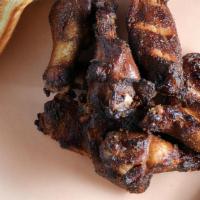 12 Wings · Dry rubbed and smoked jumbo party wings