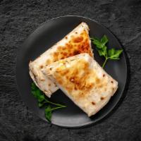 Classic Chicken Shawarma Wrap · Pita sandwich made with combination of white cheeses, wild dried thyme, sesame seeds, and su...