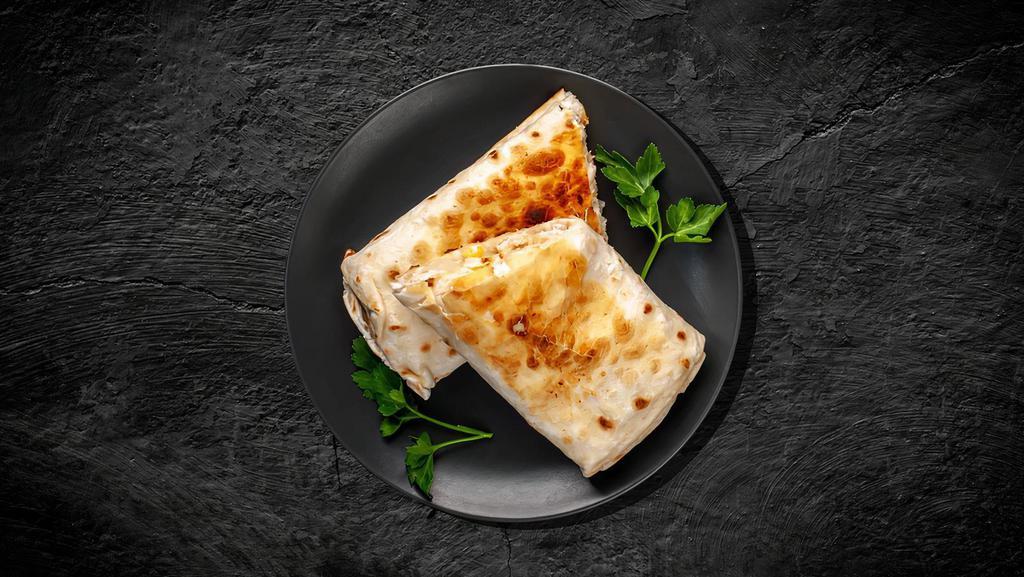 Classic Chicken Shawarma Wrap · Pita sandwich made with combination of white cheeses, wild dried thyme, sesame seeds, and sumac