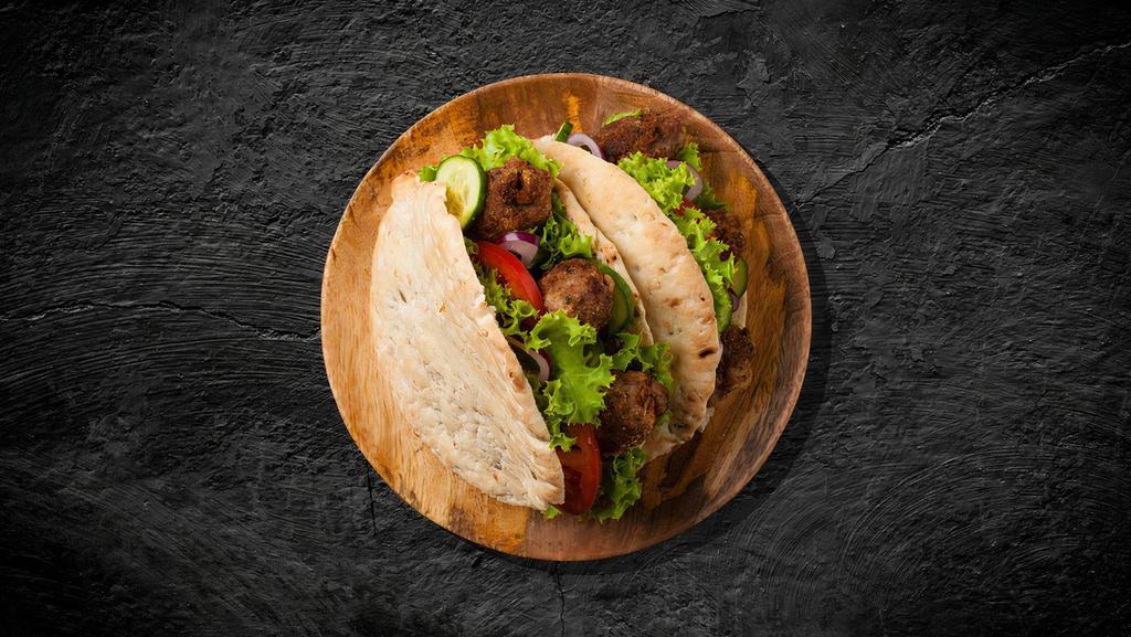 Kabab Skewers Sandwich · Toasted with choice of bread. beef kabob, tahini, and vegetables