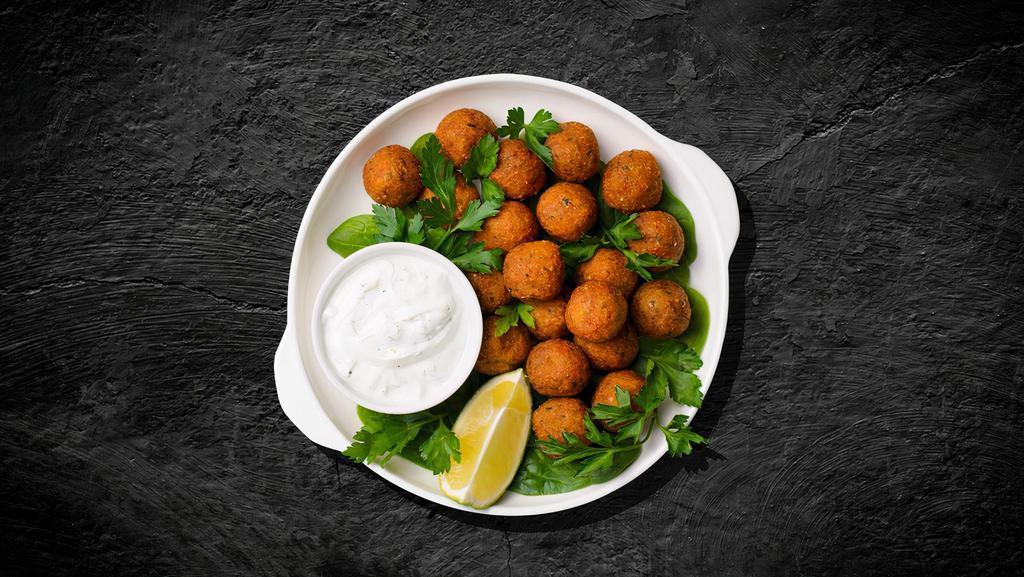 Arabian Falafel · Chickpeas are used along with fava beans, onions, cumin, and parsley. Served with tahini sauce.