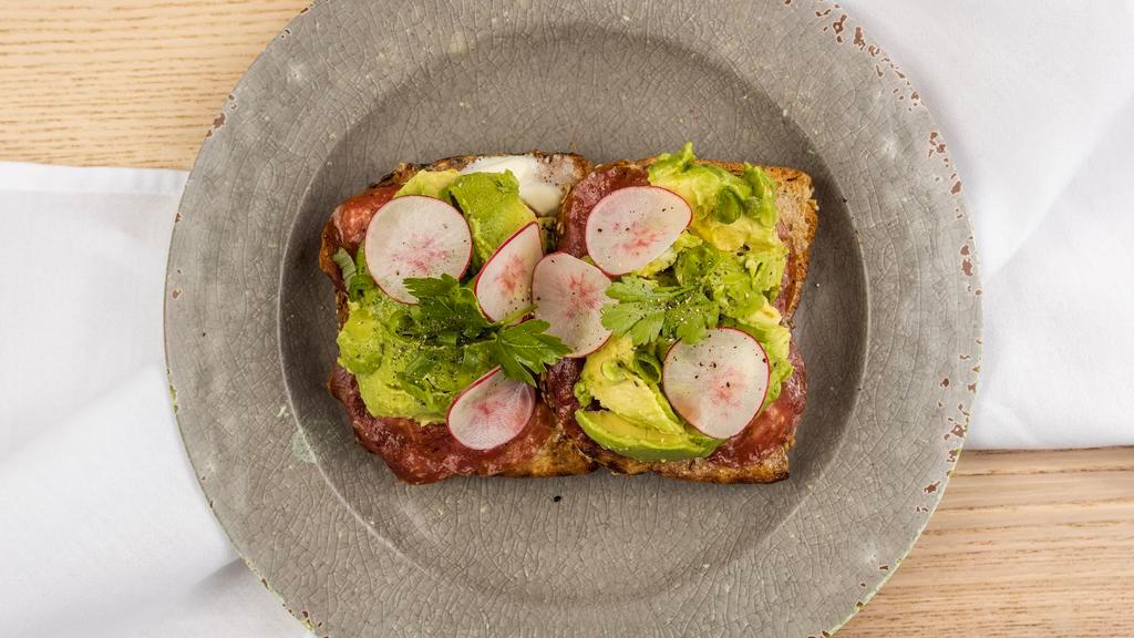 The Bev · avocado toast with rosemary garlic aioli, radish, parsley, and green onion.