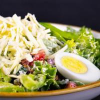 Greek Goddess Salad · Little leaf lettuce, tomato, chopped bacon, shredded cheddar cheese, hard boiled egg, avocad...