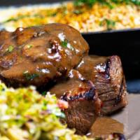 Rosemary Tenderloin Tips · Marinated steak tips finished with a rosemary demi glaze served aside French fries and brocc...
