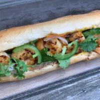 Grilled Shrimp Banh Mi · Grilled Shrimp Banh Mi on a soft crunchy roll, with a spread of mayo and pate, cucumber, dai...