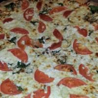 Margherita Pizza · Sliced tomatoes, fresh mozzarella & fresh basil.