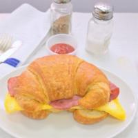 Two  Eggs With Cheese With Meat Sandwich · White ,wheat, rye, croissants or potato bread.
